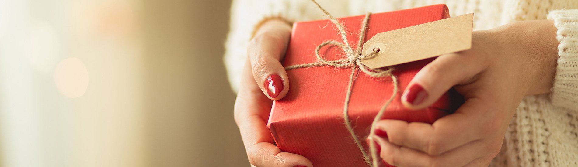 Woman holding a Christmas present