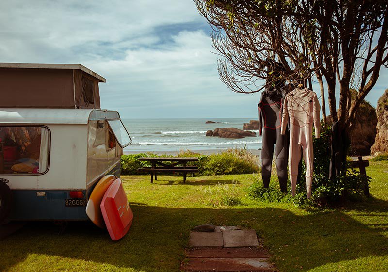 Camping with a caravan in front of the ocean