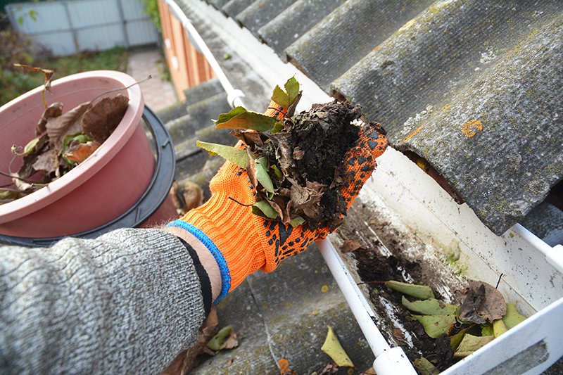 Cleaning gutters on a home