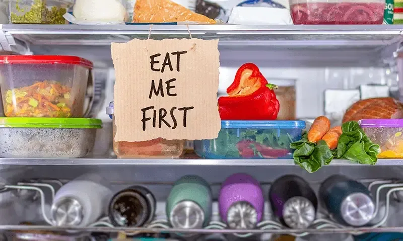 Eat Me First handmade sign in fridge