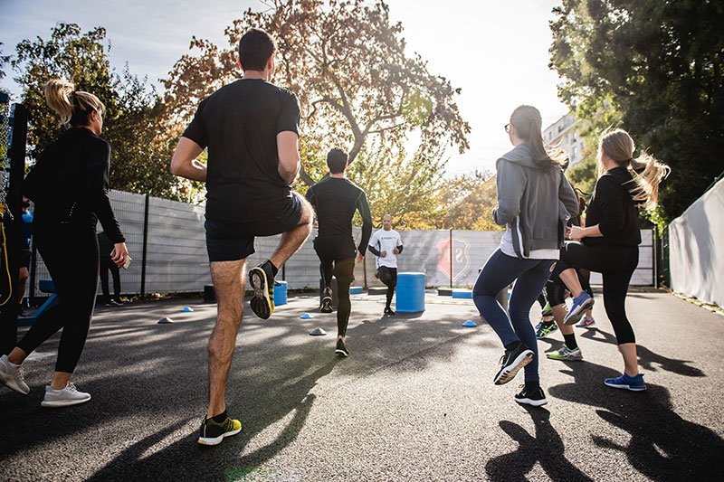 Group of adults exercising outside