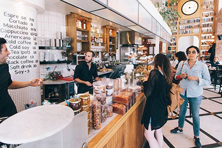 Group of people ordering at a cafe