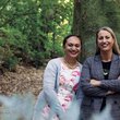 Julie and Mafi smiling in forest