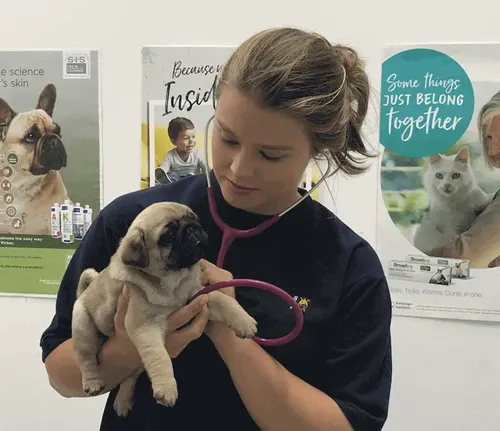 Leah Wakeford holding a puppy