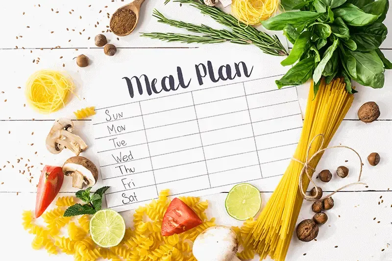 Meal-planner-surrounded-by-fruit-and-vegetables