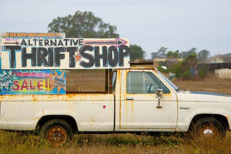 Old-car-with-sale-sign-on-back