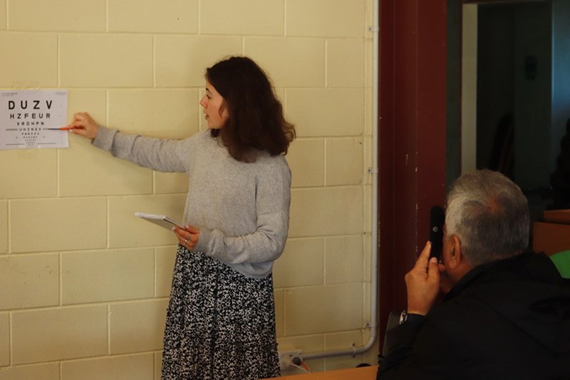 Olivia Gray volunteering at a vision screening