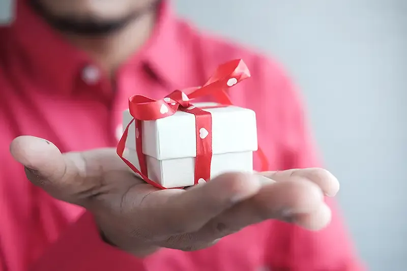 Someone holding a present in their hand
