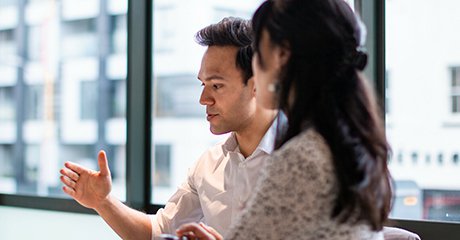 Two office people discussing something important