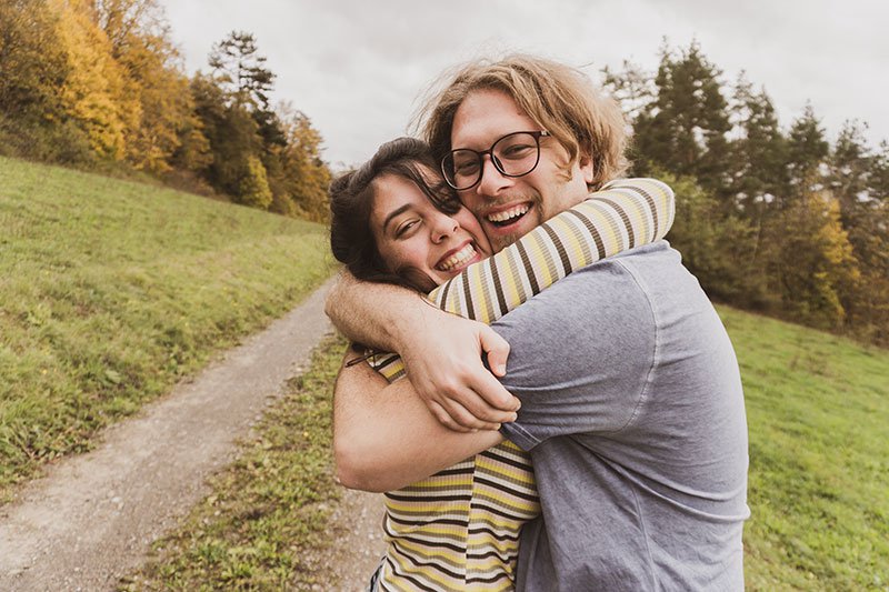 Two friends hugging