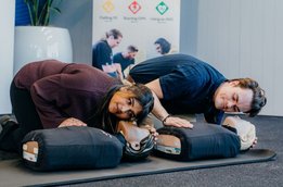 Two_people_practicing_CPR_on_dummies_at_a_3_Steps_for_Life_session narrow