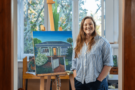 Sam Gilmour with a piece of her artwork