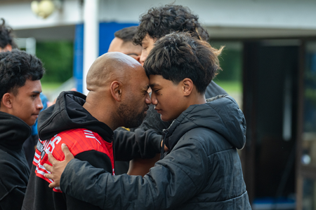 Man and boy hongi at pōwhiri