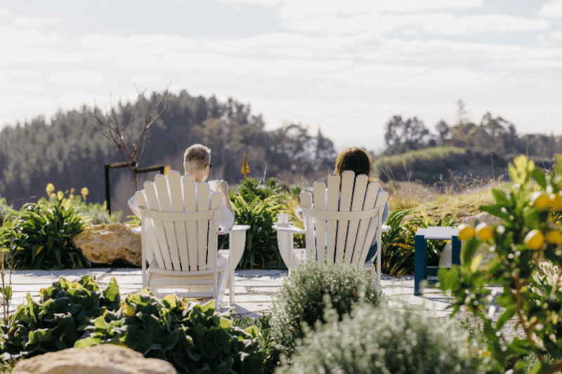 Geoff and Lynne sitting out in their backyard