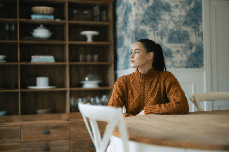 Lady sitting in the kitchen