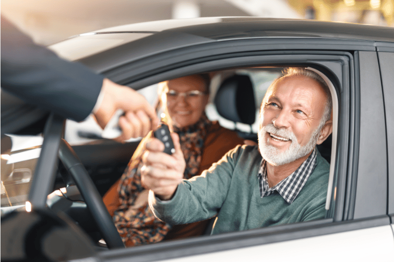 Man getting keys to new car