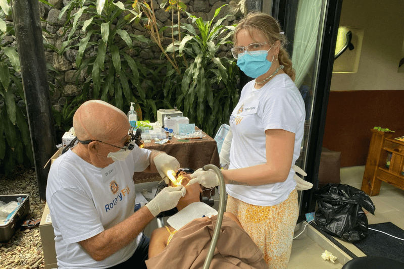 Gary doing a dental check up on a kid