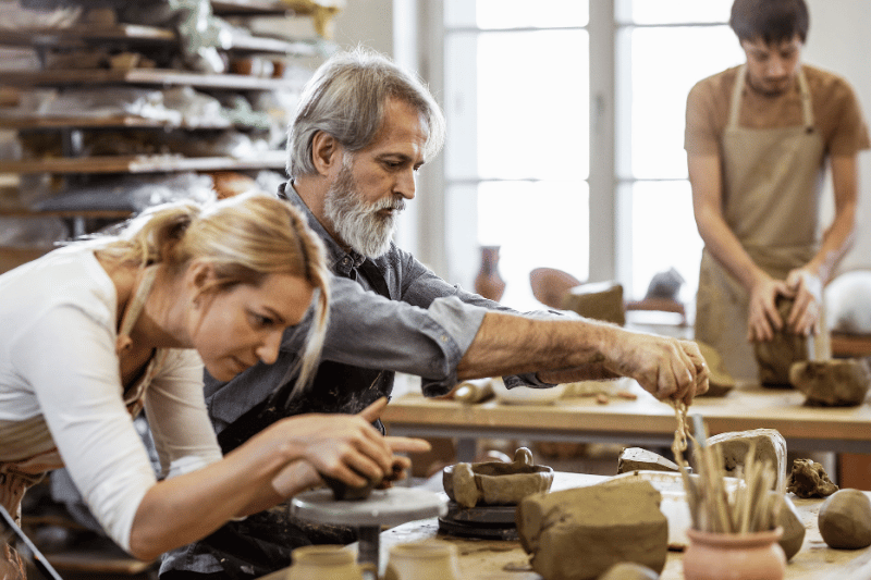 A couple making some pottery