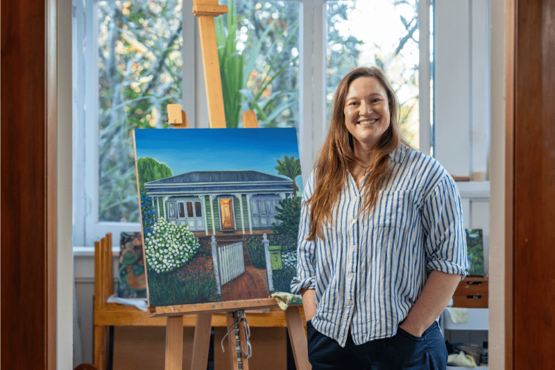 Sam Gilmour with a piece of her artwork