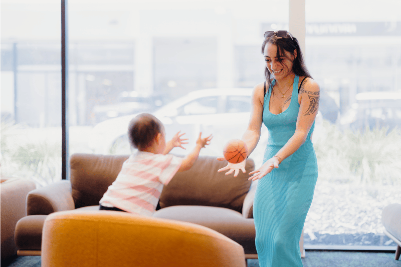 Māmā playing with a ball with her kid