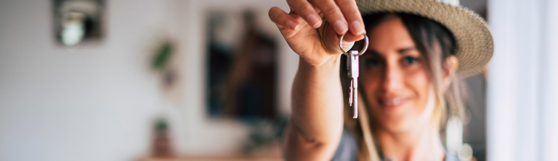 Woman holding a set of house keys