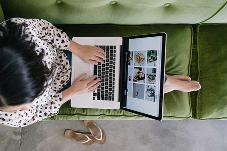 Woman-sitting-on-sofa-working-in-home-office-by-Allie-Smith-on-Unsplash.jpg