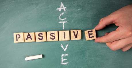 Words active and passive on a chalkboard investing - social