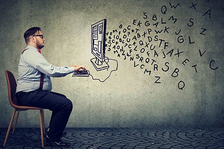 Young-man-working-on-computer-sending-email