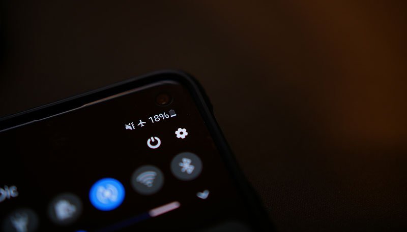 Corner of black phone showing flight mode status