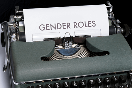 green-and-white-typewriter-with-text-gender-roles-written-on-paper