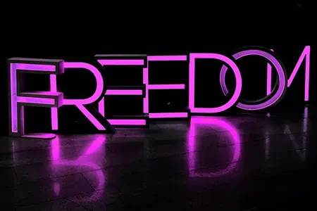 Freedom written in a purple LED display