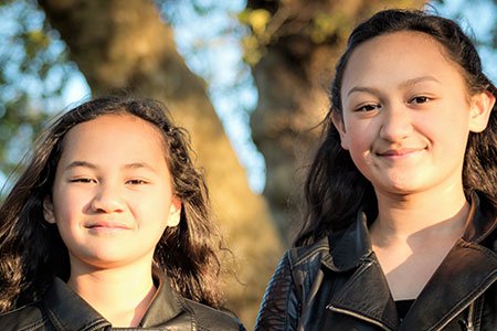 two-young-maori-girls-outside