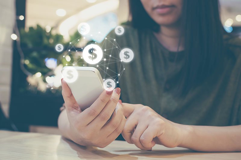 woman using phone to access banking