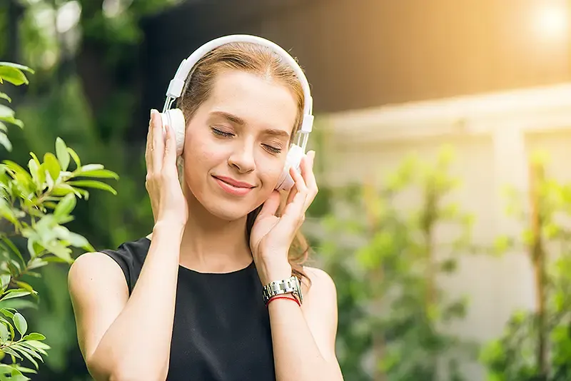 Women listening to music on headphones
